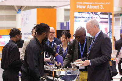 Attendees at APA’s 2022 Annual Meeting in New Orleans get a snack at one of the Mid-Day Mingles in the Exhibit Hall.