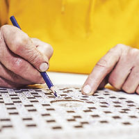 Person doing crosswords