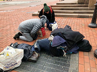 Photo of Eileen C. Reilly, M.D., and colleague Katy Swanson, N.P. doing street psychiatry in Boston.