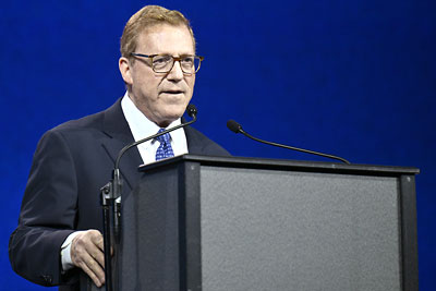 Photo: APA CEO and Medical Director Saul Levin, M.D., M.P.A, speaking from the conference podium.