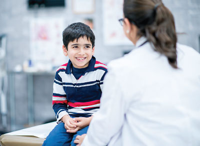 doctor chatting with young patient