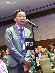 Photo: Warren Ng. M.D., testifying at the AMA House of Delegates