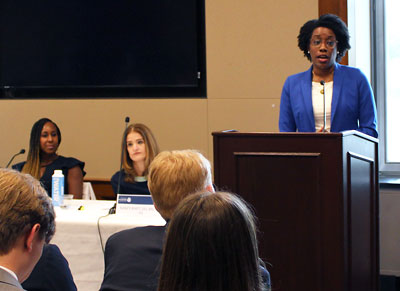 Photo: Rep. Lauren Underwood (D-Ill)., speaks to an audience of Congress members and their staff.