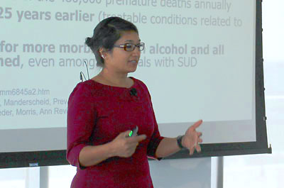 Photo: Smita Das, M.D., Ph.D., M.P.H. speaking at a meeting.