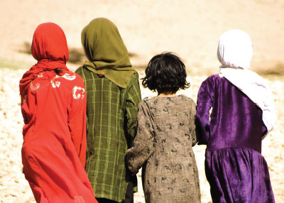 view of 4 children seen from behind