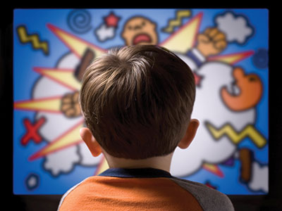 Photo of boy watching a violent cartoon
