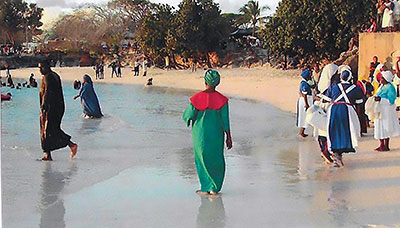 Photo of Members of the Barbados Spiritual Church attending an immersion baptismal service on the beach.