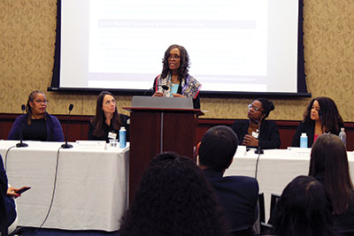 Photo of Michele Reid, M.D., speaking at a congressional briefing.