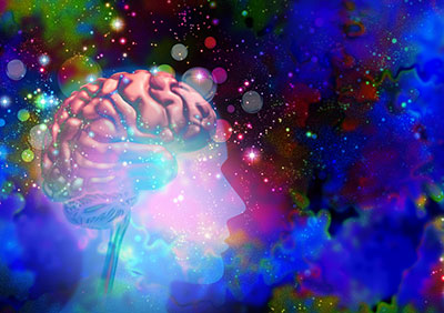 Illustration of a sihouetted head with a brain inside and psychadelic patterns and bright colors surrounding.